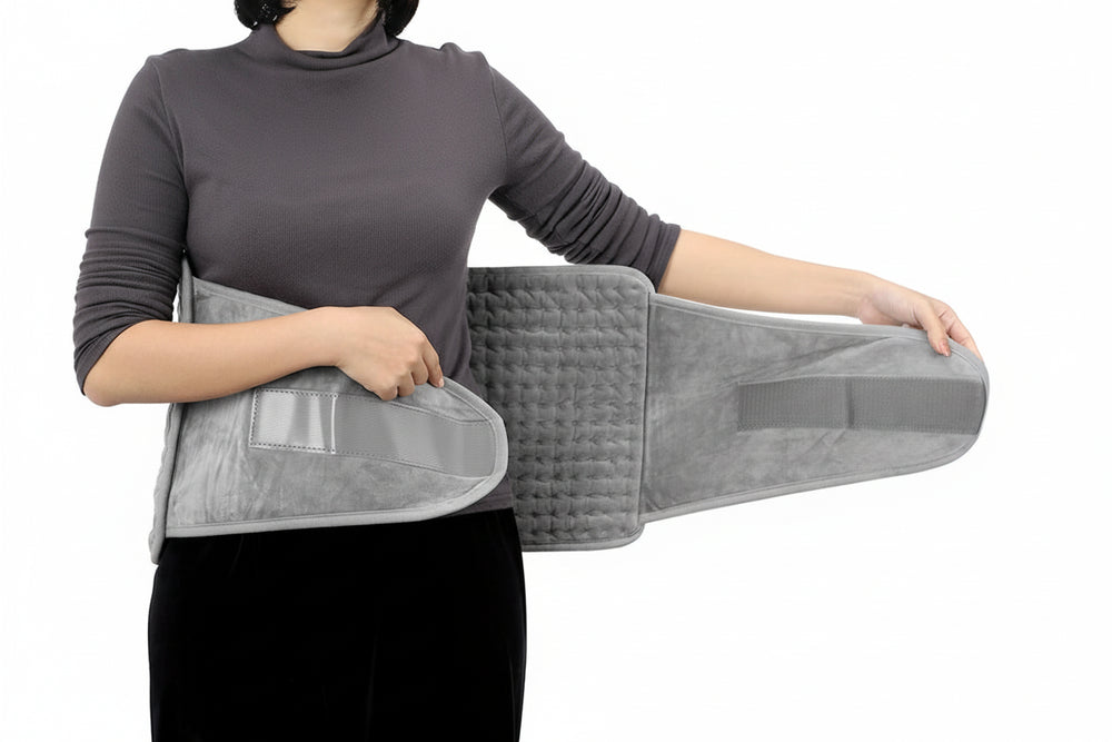 Ceinture lombaire chauffante ajustable avec larges sangles velcro pour un maintien personnalisé du bas du dos